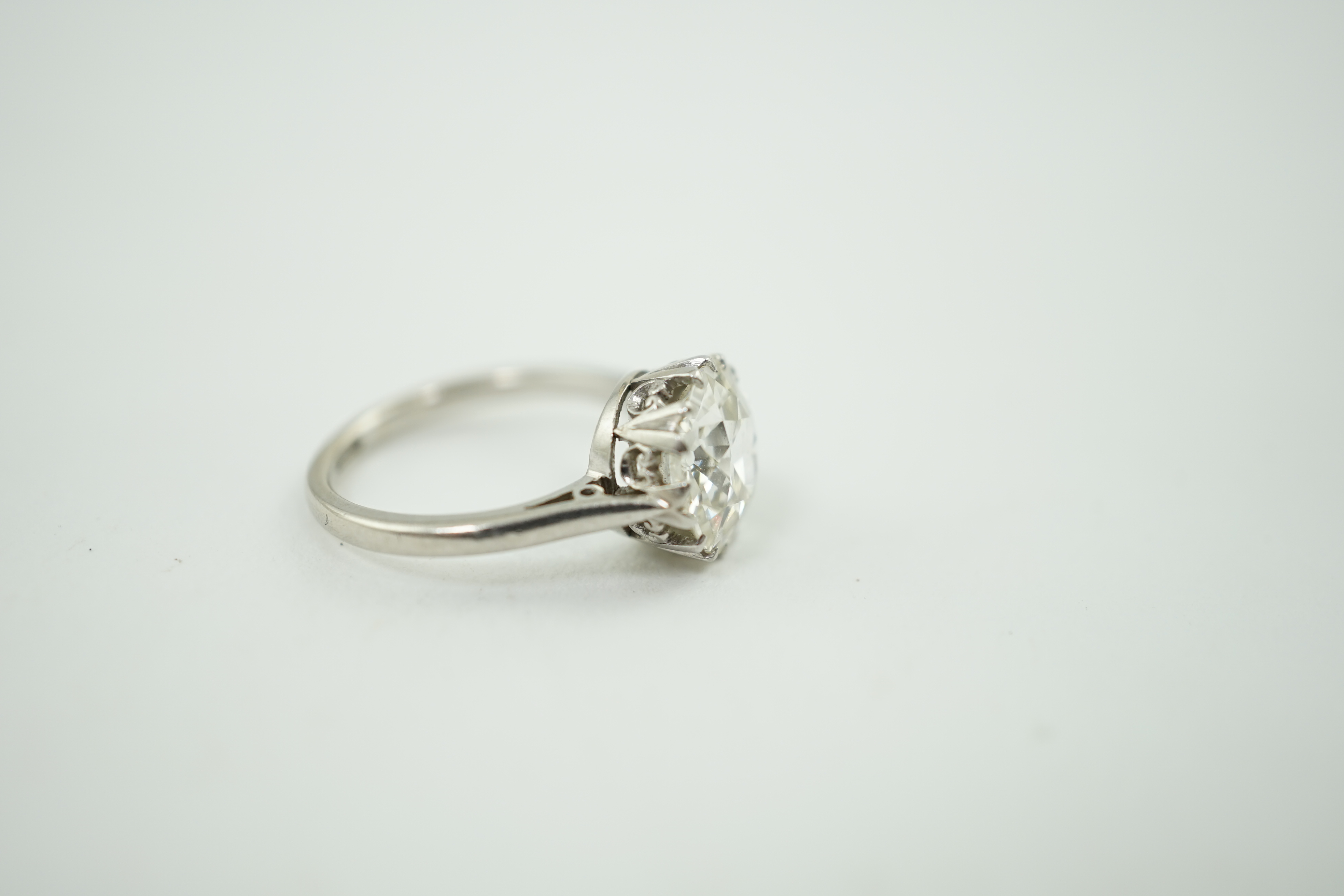 A platinum and solitaire diamond set ring